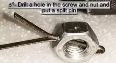 Drill a hole in the screw and nut and put a split pin